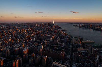 High angle view of city at sunset