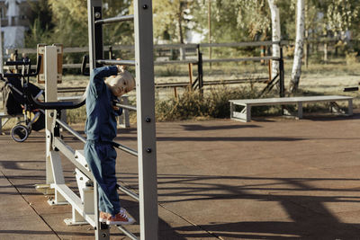 Happy boy with down syndrome performs a sports task, a disabled child, children's sports 