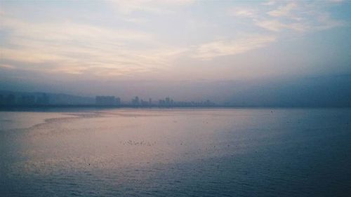 Scenic view of sea at sunset