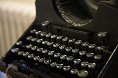 Close-up of old machine part on table