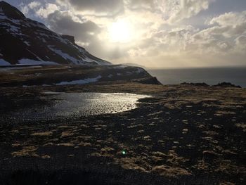 Scenic view of sea against cloudy sky