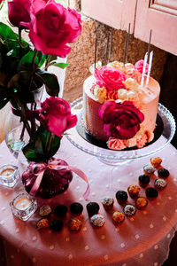 Pink roses in vase on table