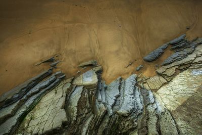 High angle view of rock formations at beach