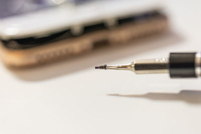 Close-up of pen on white background