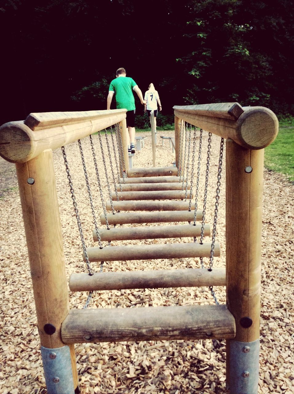 full length, steps, rear view, lifestyles, leisure activity, railing, steps and staircases, walking, staircase, childhood, casual clothing, men, sunlight, wood - material, boys, built structure, the way forward