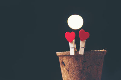 Close-up of heart shape against black background