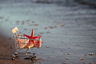 Close-up of shopping cart on table