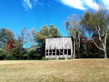 Built structure on field against sky