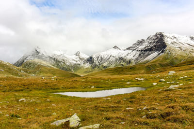 Landscape with mountain lake in swiss alps