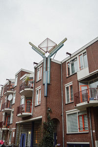 Low angle view of residential building against sky