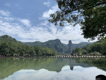 Scenic view of lake and mountains against sky