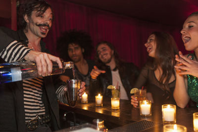 Bartender serving drinks at a nightclub