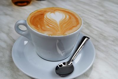 High angle view of cappuccino on table