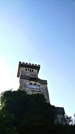 Low angle view of castle against clear blue sky