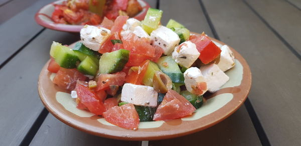 High angle view of chopped fruits in plate on table