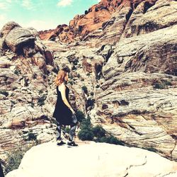 Woman standing on rock