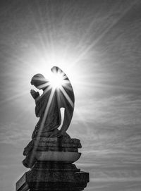 Low angle view of sculpture against sky