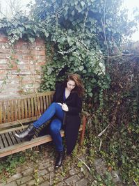 Portrait of woman sitting outdoors