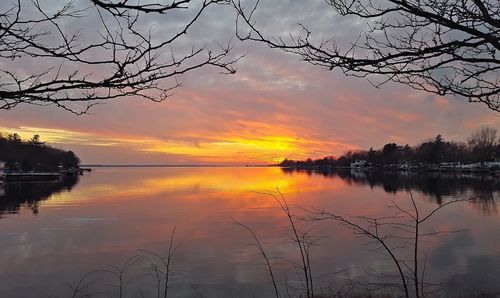 Scenic view of lake against cloudy sky