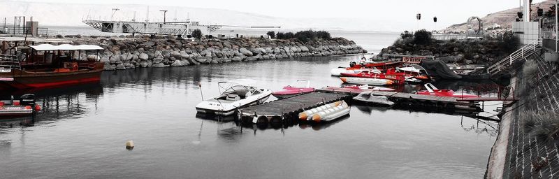 High angle view of boats moored at harbor