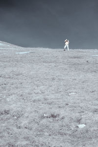 People on field against clear sky