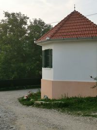 House by building against sky