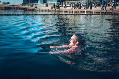 Man swimming in pool