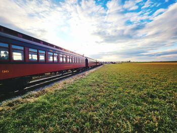 Train on railroad track against sky