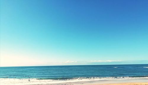 Scenic view of sea against clear blue sky