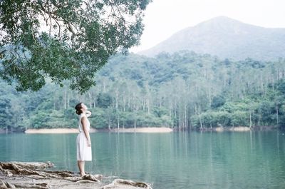 Scenic view of lake with mountains in background