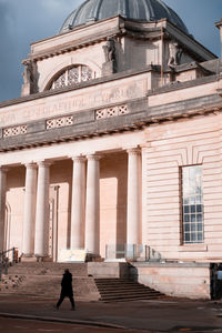 People walking on historical building