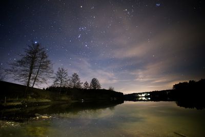 Scenic view of landscape against sky at night