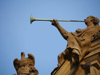 Low angle view of statue against clear sky