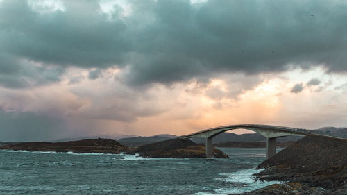 Scenic view of sea against storm clouds