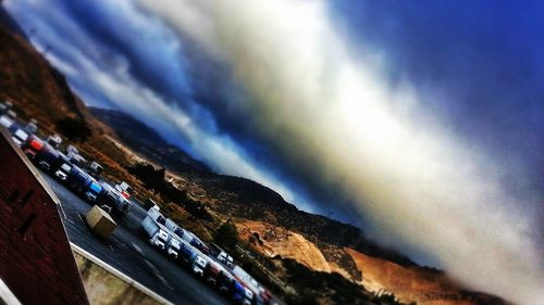 Scenic view of mountains against cloudy sky