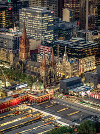 High angle view of illuminated buildings in city