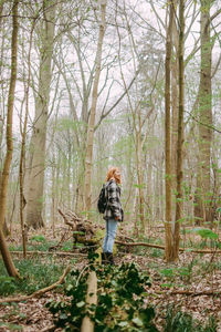 Full length of man walking in forest