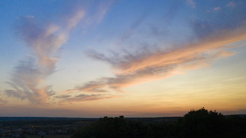 Scenic view of silhouette landscape against sky during sunset