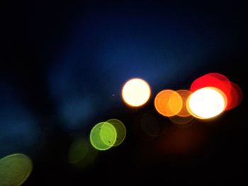 Close-up of illuminated lights at night