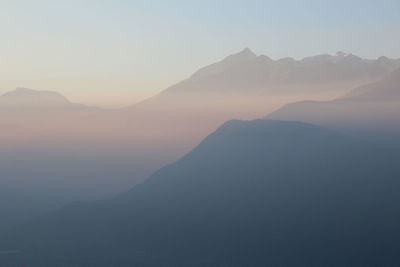 Scenic view of mountains against sky during sunset