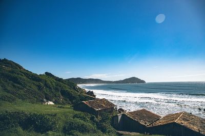 Scenic view of sea against clear blue sky