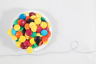 High angle view of multi colored candies on table