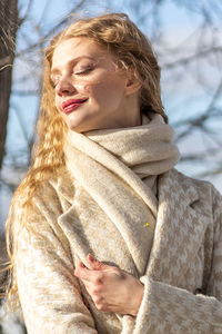 A  woman with a yellow acacia flowers. the concept of the spring - march 8, easter, women's day