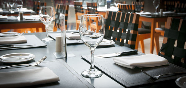 View of wine glasses on table in restaurant