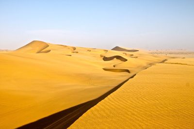 Scenic view of desert against clear sky