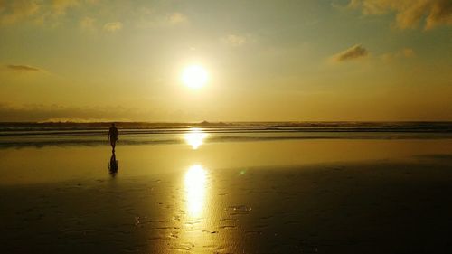 Scenic view of sea at sunset