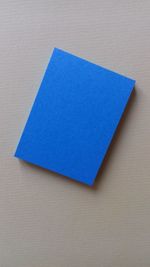 High angle view of blue paper on wall