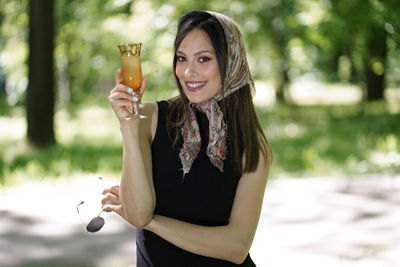 Young woman wearing sunglasses standing outdoors