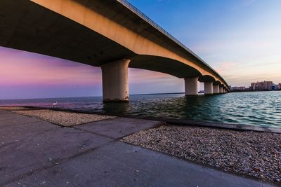 View of bridge over sea against clear sky