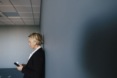 Businesswoman using cell phone